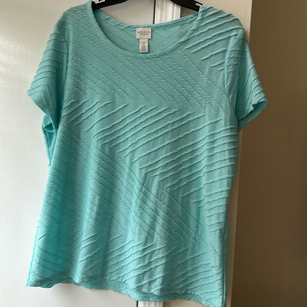 Weekends by Chico’s, size 2 (size 12).  Beautiful aqua  top.  New.